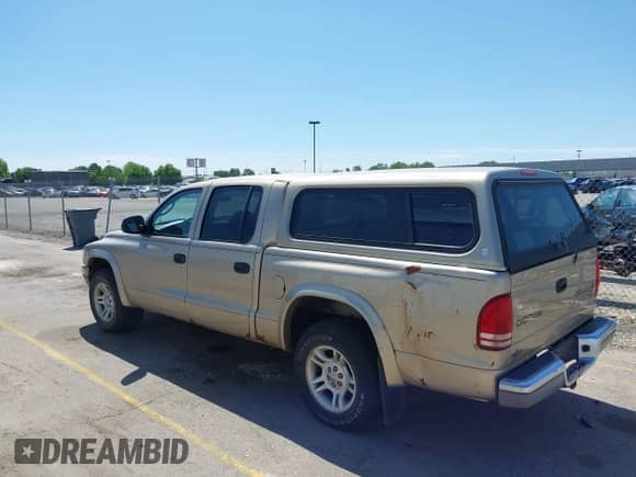 2004 Dodge Dakota SLT with VIN 1D7HL48N04S653798, listed as a IAAI auction lot 42520546 with 115,259 mi miles and . Bid and sale history available at DreamBid. Image 3.