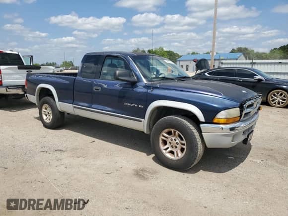 2001 Dodge Dakota with VIN 1B7GG22X01S138045, listed as a Copart auction lot 56965635 with 232,882 mi miles and Clean title. Bid and sale history available at DreamBid. Image 4.