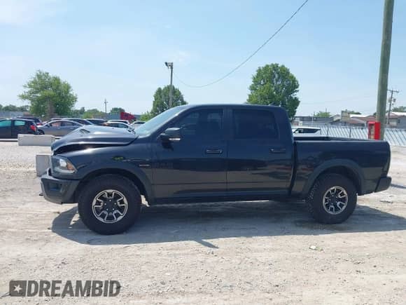 2017 Ram 1500 Rebel z VIN 1C6RR7YT7HS588233, wystawiony jako IAAI lot #42803106 z przebiegiem 129 114 mil mil oraz . Historia ofert i sprzedaży dostępna na DreamBid. Obrazek 15.