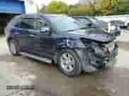 2015 Chevrolet Traverse LT with VIN 1GNKRHKD2FJ348129, listed as a Copart auction lot 85601495 with 102,579 mi miles and Salvage title. Bid and sale history available at DreamBid. Image 4.