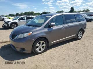 2014 Toyota Sienna LE AAS with VIN 5TDKK3DCXES518761, listed as a Copart auction lot 70665485 with 192,656 mi miles and Salvage title. Bid and sale history available at DreamBid. Image 1.