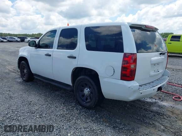 2013 Chevrolet Tahoe Commercial z VIN 1GNLC2E05DR327981, wystawiony jako IAAI lot #42835627 z przebiegiem 164 099 mil mil oraz . Historia ofert i sprzedaży dostępna na DreamBid. Obrazek 3.