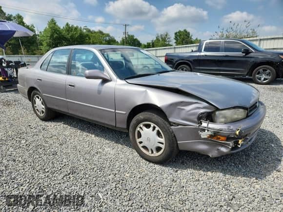 1993 Toyota Camry с VIN 4T1VK13E1PU075530, выставлен на аукционе Copart как лот 64218835 с пробегом 58 871 миль миль и Списание • Salvage title. История ставок и продаж доступна на DreamBid. Изображение 4.
