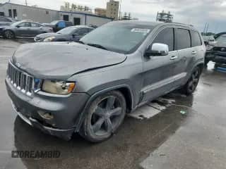 2012 Jeep Grand Cherokee Overland z VIN 1C4RJFCG4CC324216, wystawiony jako Copart lot #84020985 z przebiegiem 197 323 mil mil oraz Szkoda całkowita • Salvage title. Historia ofert i sprzedaży dostępna na DreamBid. Obrazek 1.