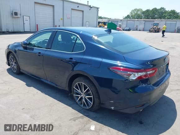 2021 Toyota Camry Hybrid XLE with VIN 4T1F31AK3MU554067, listed as a IAAI auction lot 42681018 with 53,630 mi miles and . Bid and sale history available at DreamBid. Image 3.