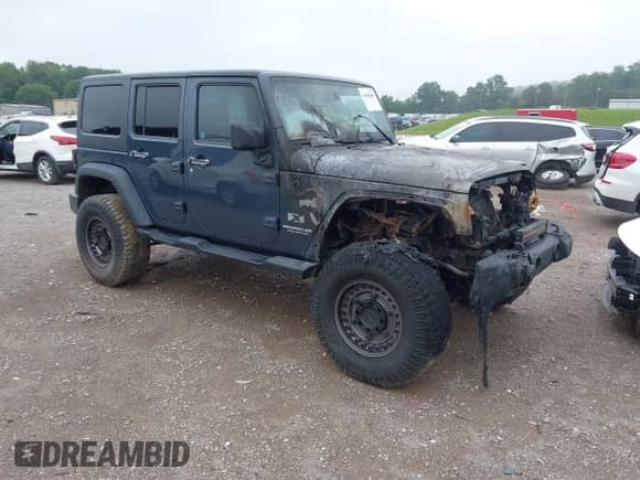 2008 Jeep Wrangler Unlimited X z VIN 1J4GA39198L509436, wystawiony jako IAAI lot #42688885 z przebiegiem Nie podano mil oraz . Historia ofert i sprzedaży dostępna na DreamBid. Obrazek 1.