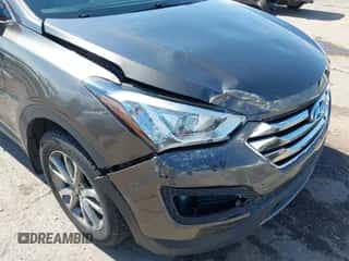 2014 Hyundai Santa Fe z VIN 5XYZU3LA4EG186807, wystawiony jako IAAI lot #43393062 z przebiegiem 67 944 mil mil oraz . Historia ofert i sprzedaży dostępna na DreamBid. Obrazek 6.