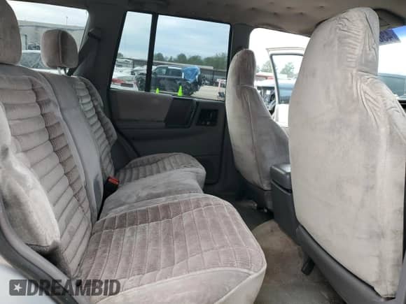 1995 Jeep Grand Cherokee Laredo with VIN 1J4GZ58S7SC517783, listed as a Copart auction lot 43057145 with 225,273 mi miles and Salvage title. Bid and sale history available at DreamBid. Image 12.