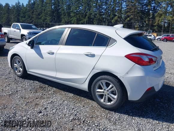 2018 Chevrolet Cruze LT z VIN 3G1BE6SM0JS558673, wystawiony jako IAAI lot #43279143 z przebiegiem 180 522 mil mil oraz . Historia ofert i sprzedaży dostępna na DreamBid. Obrazek 3.