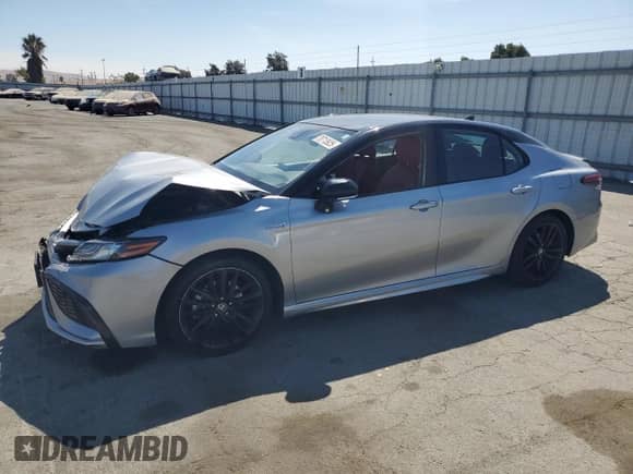 2021 Toyota Camry Hybrid XSE with VIN 4T1K31AK3MU021277, listed as a Copart auction lot 70713925 with 110,295 mi miles and Salvage title. Bid and sale history available at DreamBid. Image 1.