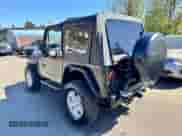 1992 Jeep Wrangler z VIN 2J4FY19P2NJ525592, wystawiony jako Copart lot #56413695 z przebiegiem 156 627 mil mil oraz Czysty tytuł • Clean title. Historia ofert i sprzedaży dostępna na DreamBid. Obrazek 3.