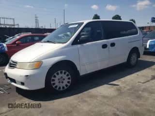 2002 Honda Odyssey LX с VIN 2HKRL18542H527520, выставлен на аукционе Copart как лот 80103335 с пробегом Не указан миль и Списание • Salvage title. История ставок и продаж доступна на DreamBid. Изображение 1.