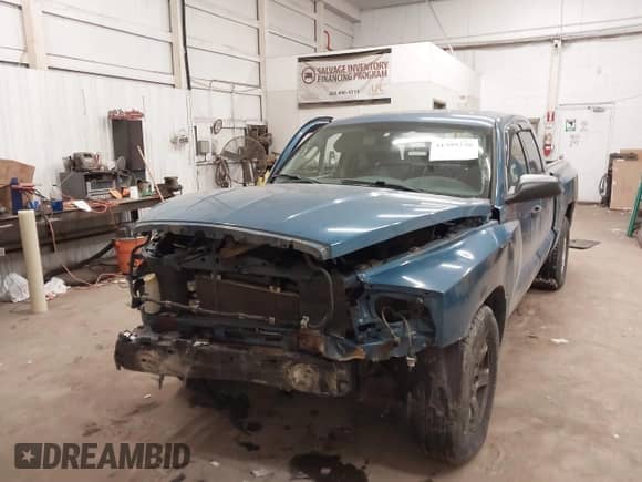 2005 Dodge Dakota SLT with VIN 1D7HW48KX5S306252, listed as a IAAI auction lot 41399238 with 140,474 mi miles and . Bid and sale history available at DreamBid. Image 2.