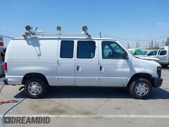 2013 Ford Econoline Cargo Commercial with VIN 1FTNE1EW2DDA35728, listed as a IAAI auction lot 42503659 with 195,340 mi miles and . Bid and sale history available at DreamBid. Image 14.