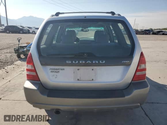 2004 Subaru Forester XS with VIN JF1SG65674H730022, listed as a Copart auction lot 71134505 with 157,196 mi miles and Salvage title. Bid and sale history available at DreamBid. Image 6.