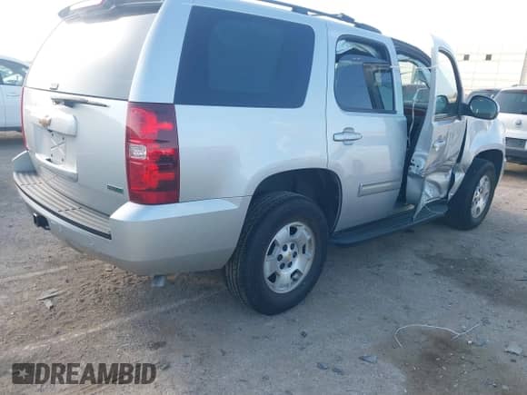 2011 Chevrolet Tahoe LS with VIN 1GNSCAE08BR219938, listed as a IAAI auction lot 42547358 with 36,396 mi miles and . Bid and sale history available at DreamBid. Image 4.