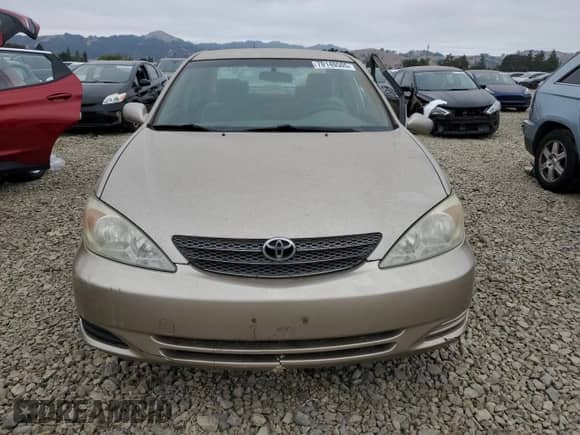 2002 Toyota Camry LE z VIN JTDBE32K920035830, wystawiony jako Copart lot #70140505 z przebiegiem 184 600 mil mil oraz Szkoda całkowita • Salvage title. Historia ofert i sprzedaży dostępna na DreamBid. Obrazek 5.