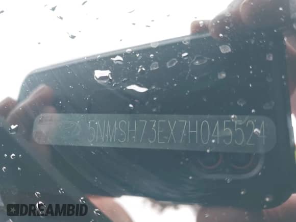 2007 Hyundai Santa Fe SE z VIN 5NMSH73EX7H045524, wystawiony jako IAAI lot #43244004 z przebiegiem 127 905 mil mil oraz . Historia ofert i sprzedaży dostępna na DreamBid. Obrazek 9.