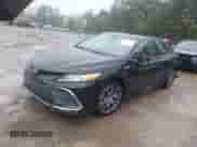 2023 Toyota Camry Hybrid XLE with VIN 4T1F31AK7PU602464, listed as a IAAI auction lot 43392293 with 41,716 mi miles and . Bid and sale history available at DreamBid. Image 2.