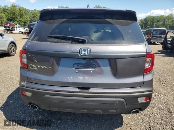 2021 Honda Passport EX-L с VIN 5FNYF8H5XMB007741, выставлен на аукционе Copart как лот 65914745 с пробегом 72 675 миль миль и Списание • Salvage title. История ставок и продаж доступна на DreamBid. Изображение 6.