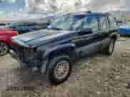 1993 Jeep Grand Cherokee Limited z VIN 1J4GZ78Y5PC544956, wystawiony jako Copart lot #84659285 z przebiegiem 153 945 mil mil oraz Szkoda całkowita • Salvage title. Historia ofert i sprzedaży dostępna na DreamBid. Obrazek 1.