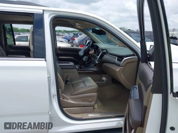 2017 Chevrolet Suburban LT with VIN 1GNSCHKC7HR115215, listed as a IAAI auction lot 42140471 with 153,705 mi miles and . Bid and sale history available at DreamBid. Image 5.