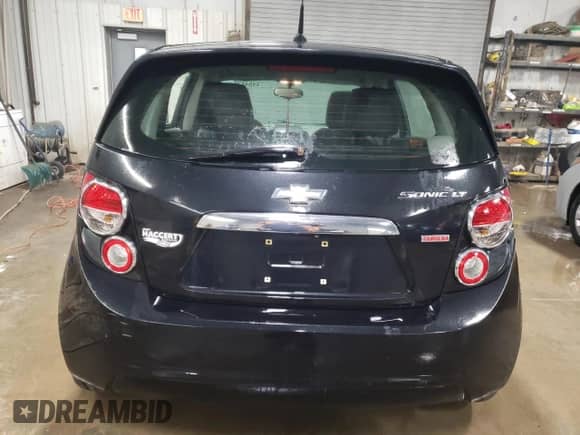 2014 Chevrolet Sonic LTZ with VIN 1G1JE6SB4E4113191, listed as a Copart auction lot 84648704 with 98,133 mi miles and Salvage title. Bid and sale history available at DreamBid. Image 6.