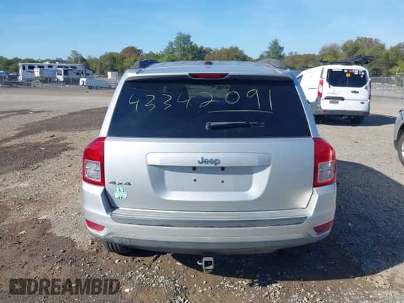 2012 Jeep Compass Sport z VIN 1C4NJDBB0CD621065, wystawiony jako IAAI lot #43342091 z przebiegiem 166 081 mil mil oraz . Historia ofert i sprzedaży dostępna na DreamBid. Obrazek 16.