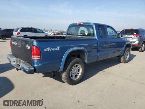 2003 Dodge Dakota with VIN 1D7GG32NX3S252020, listed as a Copart auction lot 83869424 with 258,061 mi miles and Salvage title. Bid and sale history available at DreamBid. Image 3.