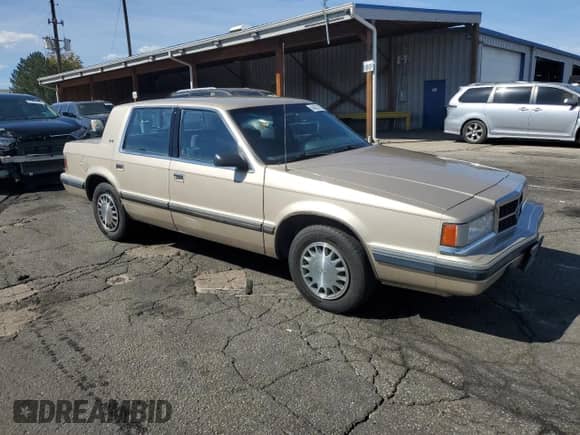 1993 Dodge Dynasty LE with VIN 1B3XC56R4PD186204, listed as a Copart auction lot 84626705 with 130,345 mi miles and Clean title. Bid and sale history available at DreamBid. Image 4.