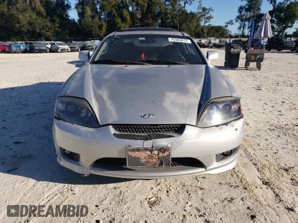 2005 Hyundai Tiburon GT с VIN KMHHN65F75U157864, выставлен на аукционе Copart как лот 75385814 с пробегом 198 670 миль миль и Списание • Salvage title. История ставок и продаж доступна на DreamBid. Изображение 5.