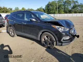 2017 Hyundai Santa Fe 2.4L z VIN 5NMZUDLB2HH002442, wystawiony jako Copart lot #70480155 z przebiegiem 90 121 mil mil oraz Szkoda całkowita • Salvage title. Historia ofert i sprzedaży dostępna na DreamBid. Obrazek 4.