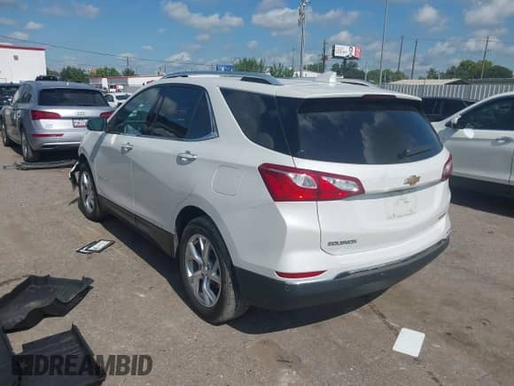 2021 Chevrolet Equinox Premier with VIN 3GNAXNEV2MS147136, listed as a IAAI auction lot 42929222 with 61,778 mi miles and . Bid and sale history available at DreamBid. Image 3.