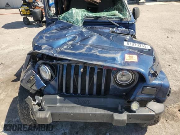 2003 Jeep Wrangler X z VIN 1J4FA39S43P357281, wystawiony jako Copart lot #67979335 z przebiegiem Nie podano mil oraz Szkoda całkowita • Salvage title. Historia ofert i sprzedaży dostępna na DreamBid. Obrazek 11.