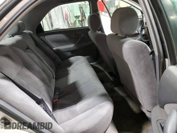 2001 Toyota Camry LE z VIN 4T1BG22K81U842010, wystawiony jako Copart lot #87473015 z przebiegiem 150 625 mil mil oraz Czysty tytuł • Clean title. Historia ofert i sprzedaży dostępna na DreamBid. Obrazek 10.