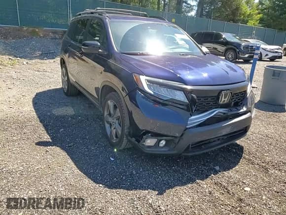 2021 Honda Passport Touring with VIN 5FNYF8H92MB042258, listed as a Copart auction lot 68150945 with 60,684 mi miles and Salvage title. Bid and sale history available at DreamBid. Image 14.