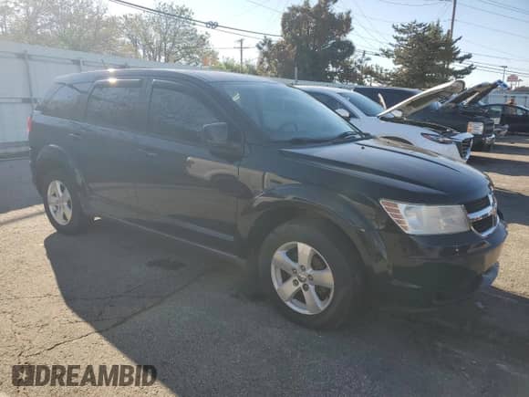 2009 Dodge Journey SXT with VIN 3D4GG57V29T237780, listed as a Copart auction lot 85690795 with 82,843 mi miles and Salvage title. Bid and sale history available at DreamBid. Image 4.