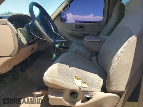 1999 Ford F-150 z VIN 1FTRX18W5XKA09616, wystawiony jako Copart lot #67121555 z przebiegiem Nie podano mil oraz Szkoda całkowita • Salvage title. Historia ofert i sprzedaży dostępna na DreamBid. Obrazek 7.