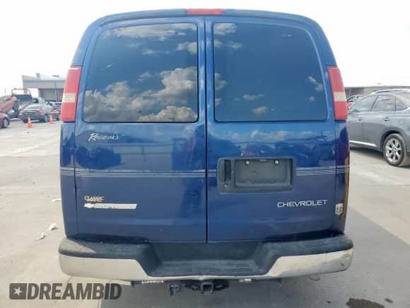2004 Chevrolet Express Passenger with VIN 1GBFG15T041233492, listed as a Copart auction lot 82193815 with 219,338 mi miles and Salvage title. Bid and sale history available at DreamBid. Image 6.