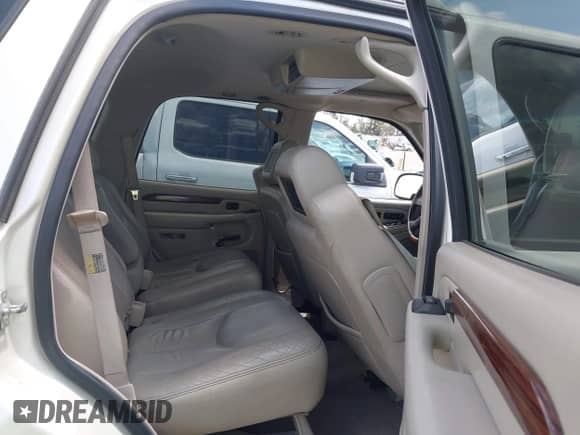 2004 Cadillac Escalade with VIN 1GYEC63T54R235754, listed as a IAAI auction lot 43121128 with 105,629 mi miles and . Bid and sale history available at DreamBid. Image 8.