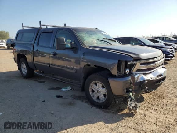 2011 Chevrolet Silverado 1500 LTZ with VIN 3GCPKTE32BG162899, listed as a Copart auction lot 83950435 with 136,170 mi miles and Salvage title. Bid and sale history available at DreamBid. Image 4.