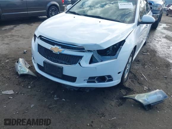 2014 Chevrolet Cruze 1LT z VIN 1G1PC5SB8E7297057, wystawiony jako IAAI lot #43383534 z przebiegiem 196 127 mil mil oraz . Historia ofert i sprzedaży dostępna na DreamBid. Obrazek 6.