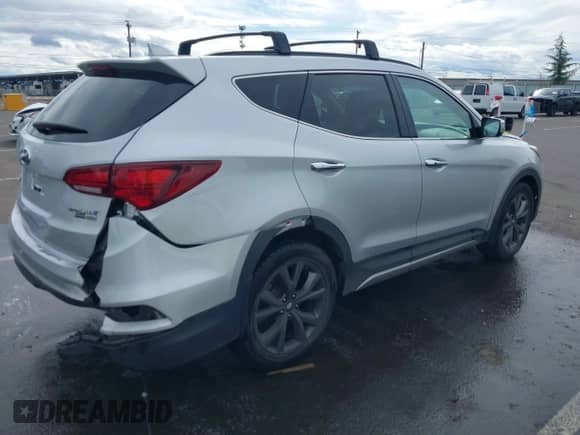 2018 Hyundai Santa Fe Ultimate with VIN 5XYZWDLA7JG542869, listed as a IAAI auction lot 41889520 with 51,294 mi miles and . Bid and sale history available at DreamBid. Image 4.