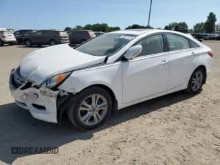 2013 Hyundai Sonata Limited с VIN 5NPEC4AC9DH659121, выставлен на аукционе Copart как лот 80671415 с пробегом 147 711 миль миль и Списание • Salvage title. История ставок и продаж доступна на DreamBid. Изображение 1.