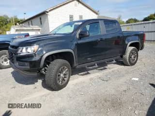 2021 Chevrolet Colorado 4WD ZR2 with VIN 1GCPTEE12M1293033, listed as a Copart auction lot 80183945 with 28,003 mi miles and Salvage title. Bid and sale history available at DreamBid. Image 1.