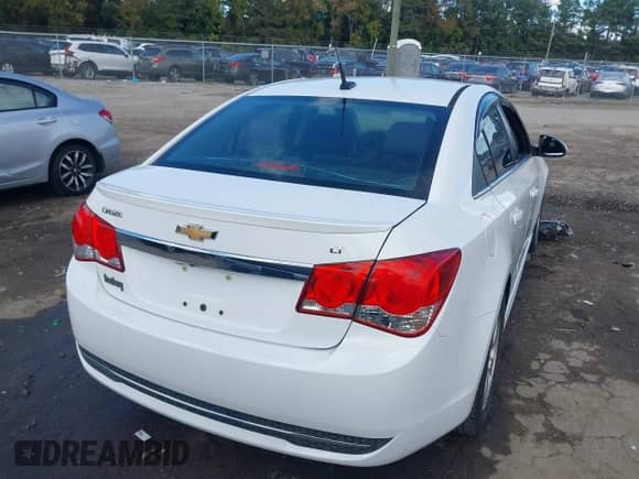 2014 Chevrolet Cruze 1LT z VIN 1G1PC5SB8E7297057, wystawiony jako IAAI lot #43383534 z przebiegiem 196 127 mil mil oraz . Historia ofert i sprzedaży dostępna na DreamBid. Obrazek 4.