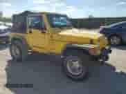 2000 Jeep Wrangler Sport z VIN 1J4FA49S0YP763894, wystawiony jako Copart lot #83925635 z przebiegiem 205 752 mil mil oraz Czysty tytuł • Clean title. Historia ofert i sprzedaży dostępna na DreamBid. Obrazek 4.