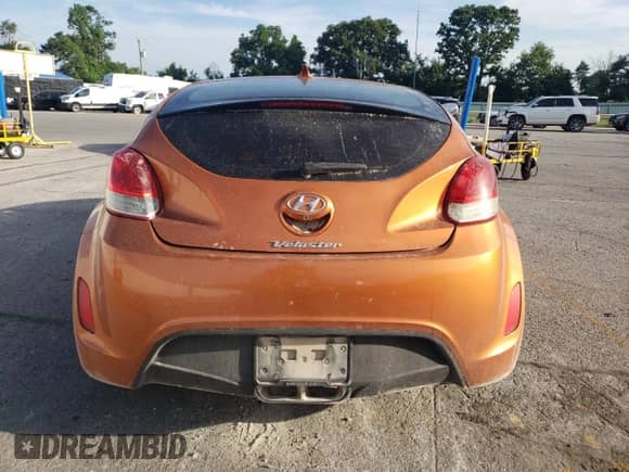 2014 Hyundai Veloster с VIN KMHTC6AD0EU186823, выставлен на аукционе Copart как лот 62018445 с пробегом 149 389 миль миль и Списание • Salvage title. История ставок и продаж доступна на DreamBid. Изображение 6.