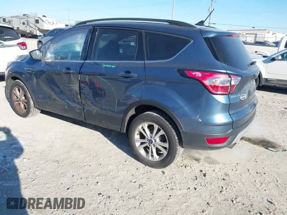 2018 Ford Escape SE with VIN 1FMCU9GD2JUA21484, listed as a IAAI auction lot 41285765 with 102,523 mi miles and . Bid and sale history available at DreamBid. Image 3.