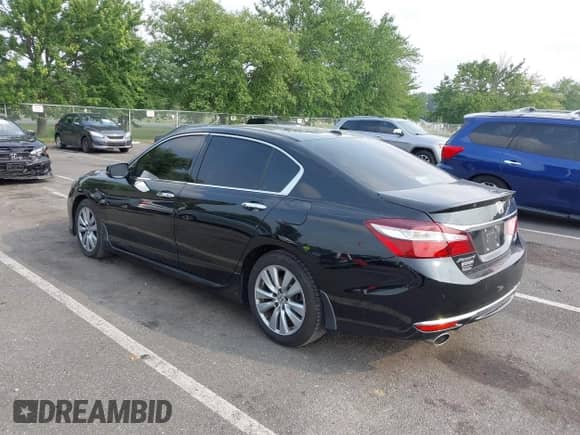 2017 Honda Accord Touring with VIN 1HGCR3F96HA026801, listed as a IAAI auction lot 42938315 with 71,156 mi miles and . Bid and sale history available at DreamBid. Image 3.